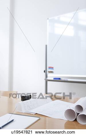 Stock Image - Whiteboard and table in empty board room. Fotosearch