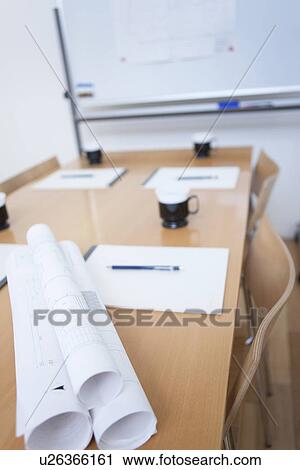 Stock Image - Whiteboard and table in empty board room. Fotosearch