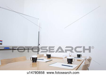 Stock Photo - Whiteboard and table in empty board room. Fotosearch