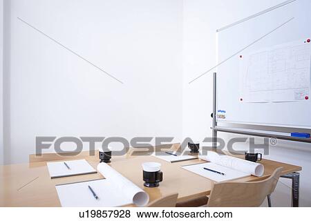 Stock Photo - Whiteboard and table in empty board room. Fotosearch