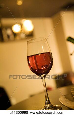 Wineglass on a table View Large Photo Image Stock Photo - Wineglass on a table. Fotosearch