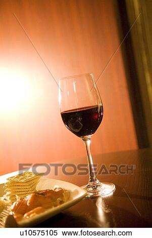 Stock Photography - Wineglass on a table. Fotosearch