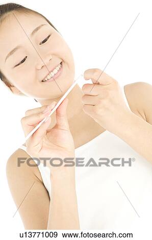 Woman filing her nails View Large Photo Image Stock Photo - Woman filing her nails. Fotosearch