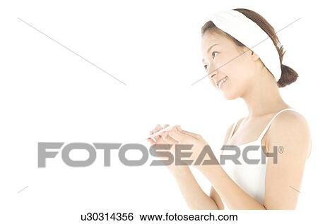Stock Photograph - Woman filing her nails. Fotosearch