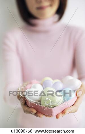 Woman holding heart shaped soaps View Large Photo Image Stock Photograph - Woman holding heart shaped soaps. Fotosearch