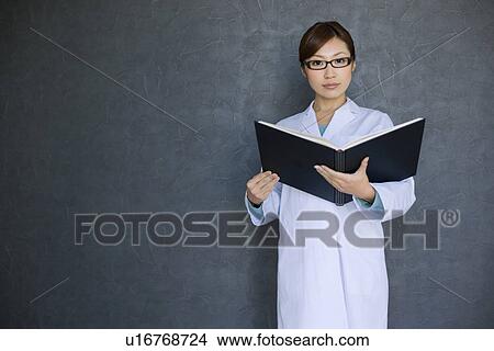Woman in lab coat doing research View Large Photo Image Picture - Woman in lab coat doing research. Fotosearch