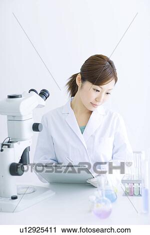 Stock Image - Woman in laboratory. Fotosearch