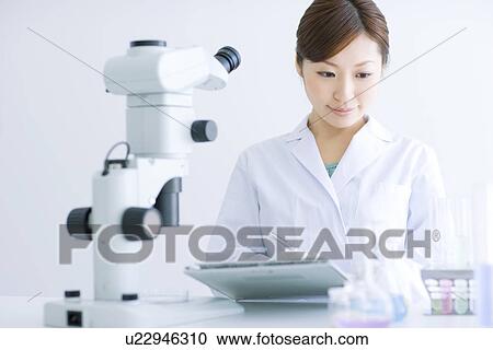 Stock Image - Woman in laboratory. Fotosearch