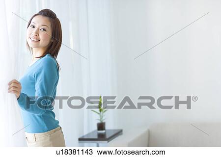 Woman looking out of window View Large Photo Image Stock Image - Woman looking out of window. Fotosearch