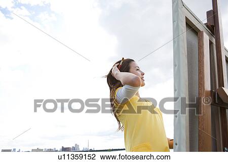 Woman painting in a field View Large Photo Image Stock Image - Woman painting in a field. Fotosearch