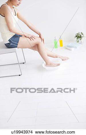 Picture - Woman pampering her feet. Fotosearch