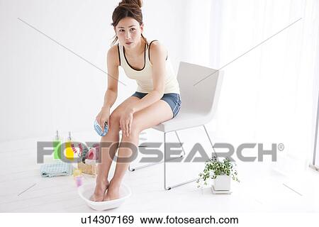 Stock Photo - Woman pampering her feet. Fotosearch