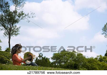 Woman playing a French horn View Large Photo Image Stock Photograph - Woman playing a French horn. Fotosearch