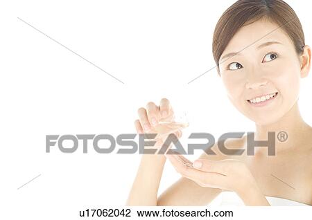 Woman pouring oil into palm View Large Photo Image Stock Image - Woman pouring oil into palm. Fotosearch