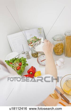 Woman preparing meal View Large Photo Image Stock Photograph - Woman preparing meal. Fotosearch