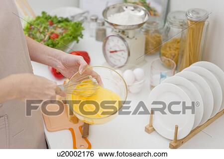 Woman preparing meal View Large Photo Image Stock Photograph - Woman preparing meal. Fotosearch