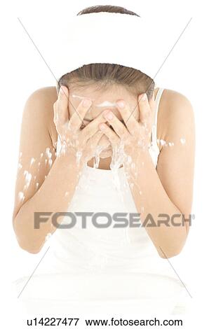 Woman rinsing face with water View Large Photo Image Stock Photo - Woman rinsing face with water. Fotosearch