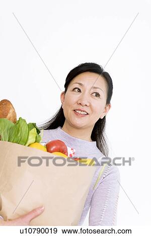 Woman shopping for groceries View Large Photo Image Stock Photo - Woman shopping for groceries. Fotosearch