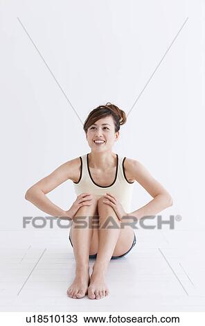 Woman sitting on floor View Large Photo Image Stock Image - Woman sitting on floor. Fotosearch