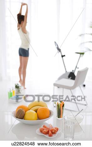 Stock Photo - Woman stretching after a work out. Fotosearch