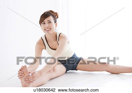 Stock Image - Woman stretching. Fotosearch