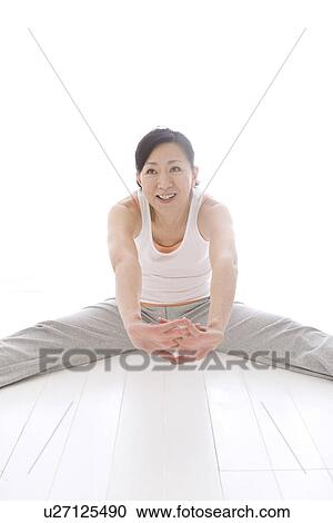 Stock Image - Woman stretching. Fotosearch