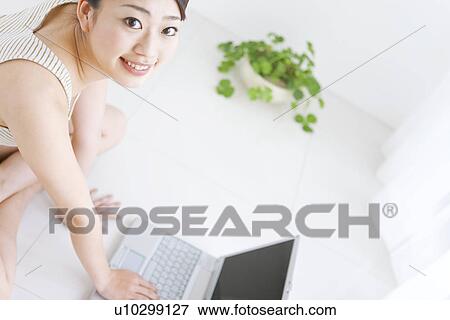 Woman using laptop computer View Large Photo Image Stock Photo - Woman using laptop computer. Fotosearch