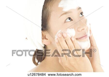 Woman washing her face View Large Photo Image Picture - Woman washing her face. Fotosearch