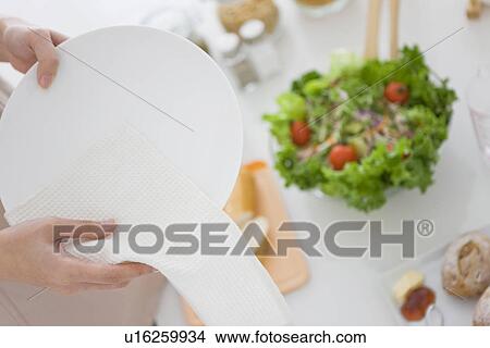 Woman wiping plate with cloth View Large Photo Image Picture - Woman wiping plate with cloth. Fotosearch