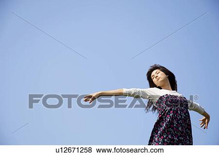 Woman with arms open View Large Photo Image Stock Photo - Woman with arms open. Fotosearch