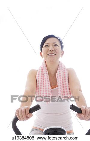 Woman working out View Large Photo Image Stock Photo - Woman working out. Fotosearch