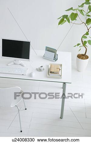 Work desk in room with potted plant View Large Photo Image Stock Image - Work desk in room with potted plant. Fotosearch