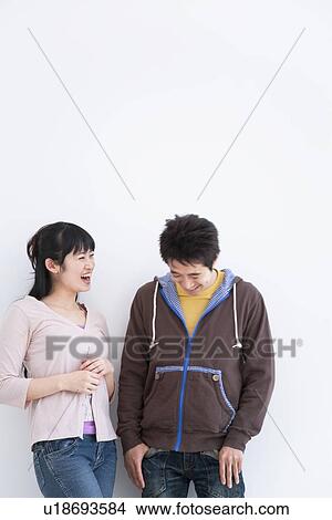 Young couple laughing View Large Photo Image Picture - Young couple laughing. Fotosearch