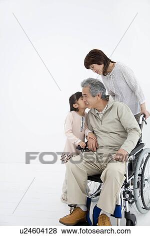 Young girl kissing grandfather on cheek View Large Photo Image Stock Photo - Young girl kissing grandfather on cheek. Fotosearch