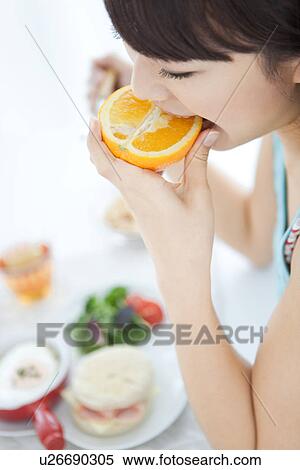 Young woman having breakfast View Large Photo Image Stock Photography - Young woman having breakfast. Fotosearch