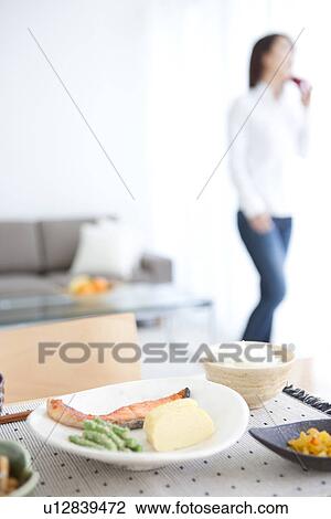 Young woman talking on the phone View Large Photo Image Stock Image - Young woman talking on the phone. Fotosearch
