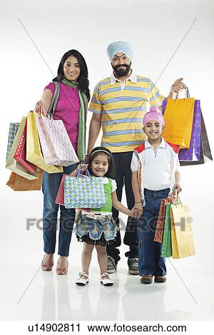 Family with shopping bags View Large Photo Image Stock Image - Family with shopping bags. Fotosearch