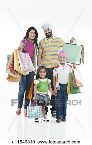 Family with shopping bags View Large Photo Image Stock Photo - Family with shopping bags. Fotosearch