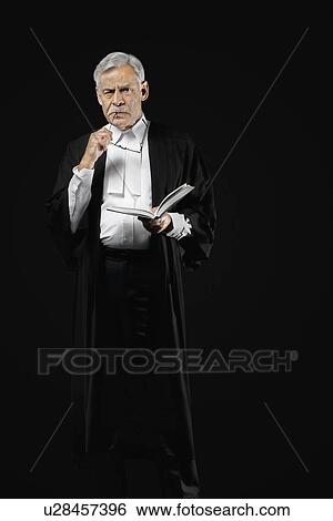 Stock Photograph - Lawyer holding a law book. Fotosearch