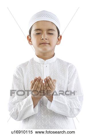 Stock Photography - Muslim boy praying. Fotosearch