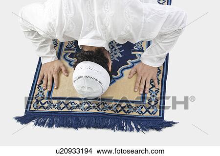 Picture - Muslim man praying. Fotosearch