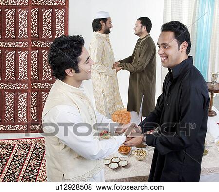 Stock Photo - Muslim men greeting each other. Fotosearch