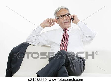 Old businessman taking on the phone View Large Photo Image Stock Image - Old businessman taking on the phone. Fotosearch