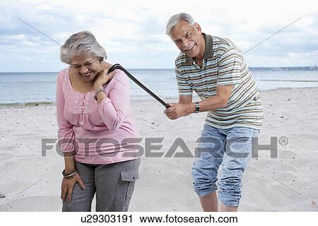 Stock Image - Old couple having fun. Fotosearch