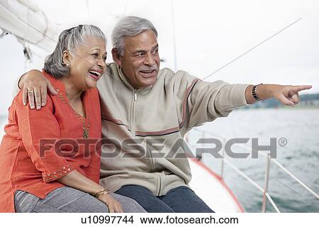 Picture - Old couple looking at something. Fotosearch