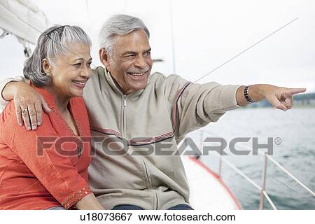 Stock Photo - Old couple looking at something. Fotosearch