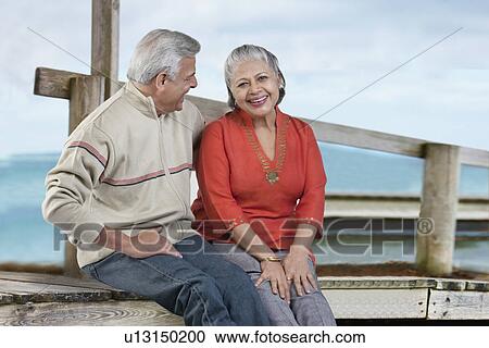 Old couple sitting together View Large Photo Image Stock Image - Old couple sitting together. Fotosearch