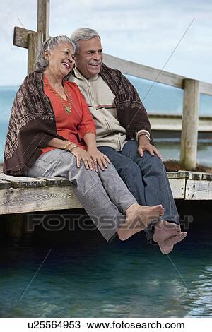 Stock Image - Old couple sitting together. Fotosearch