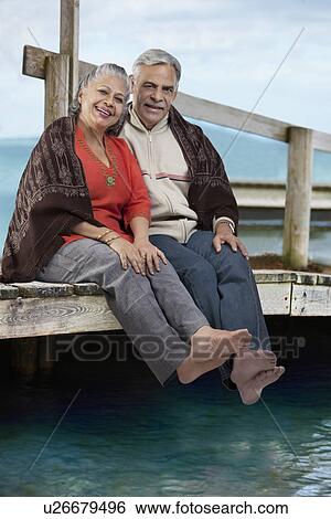 Stock Photograph - Old couple sitting together. Fotosearch