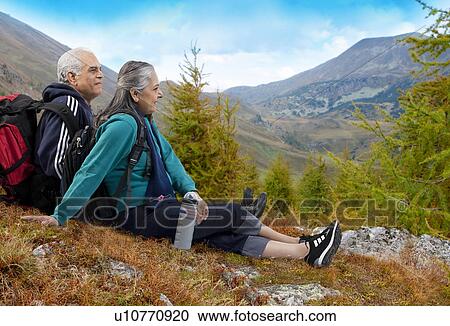 Old couple with hiking gear View Large Photo Image Stock Image - Old couple with hiking gear. Fotosearch